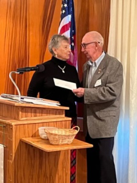 Hanford Rotary Foundation presents grant award to Kings County Library Joe Casey, of Hanford Rotary Foundation presents grant award to Marlene DiNicola, VP of Friends of the KC Library.